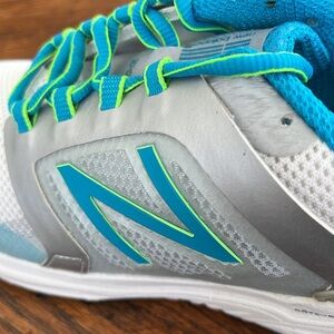 New Balance Women’s White and Silver Sneakers